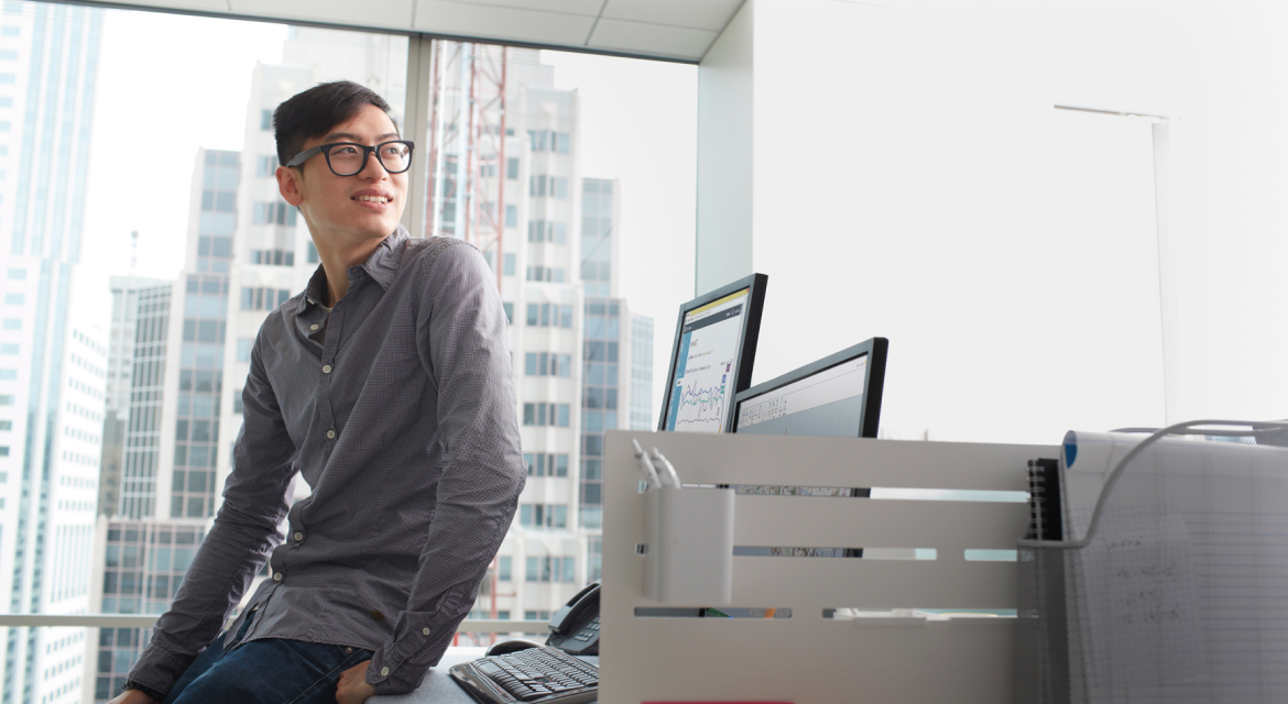 Person standing in front of a computer