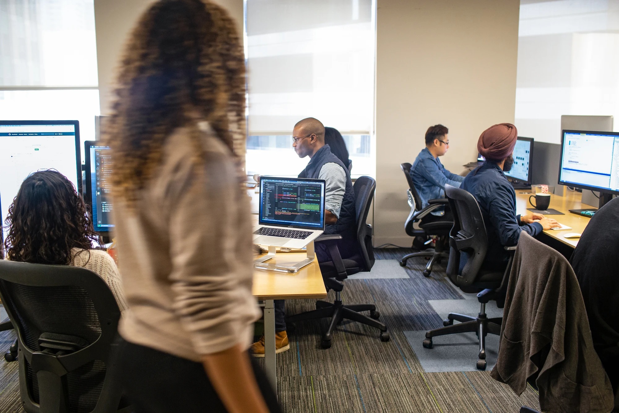 An office setting of people using computers