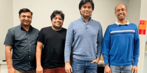 Janam Singh, Ratnagiri, Mandal, and Venkatesan smile at the camera in a group photo taken in a Microsoft building common area.