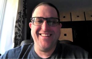 Patton smiles in a portrait photo.