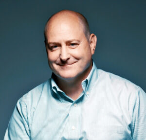 Whittinghill smiles in a corporate photo.