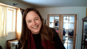 Pfluger smiles in a screenshot of her taken from a video interview. She’s shown from her home office.