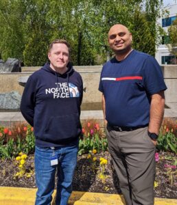 Prentice and Dadwal pose for a photo outside a Microsoft office.