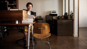 Microsoft employee works at their desk in a Microsoft office.