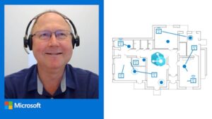 Eric Slippern is seen in his home office smiling towards the camera.