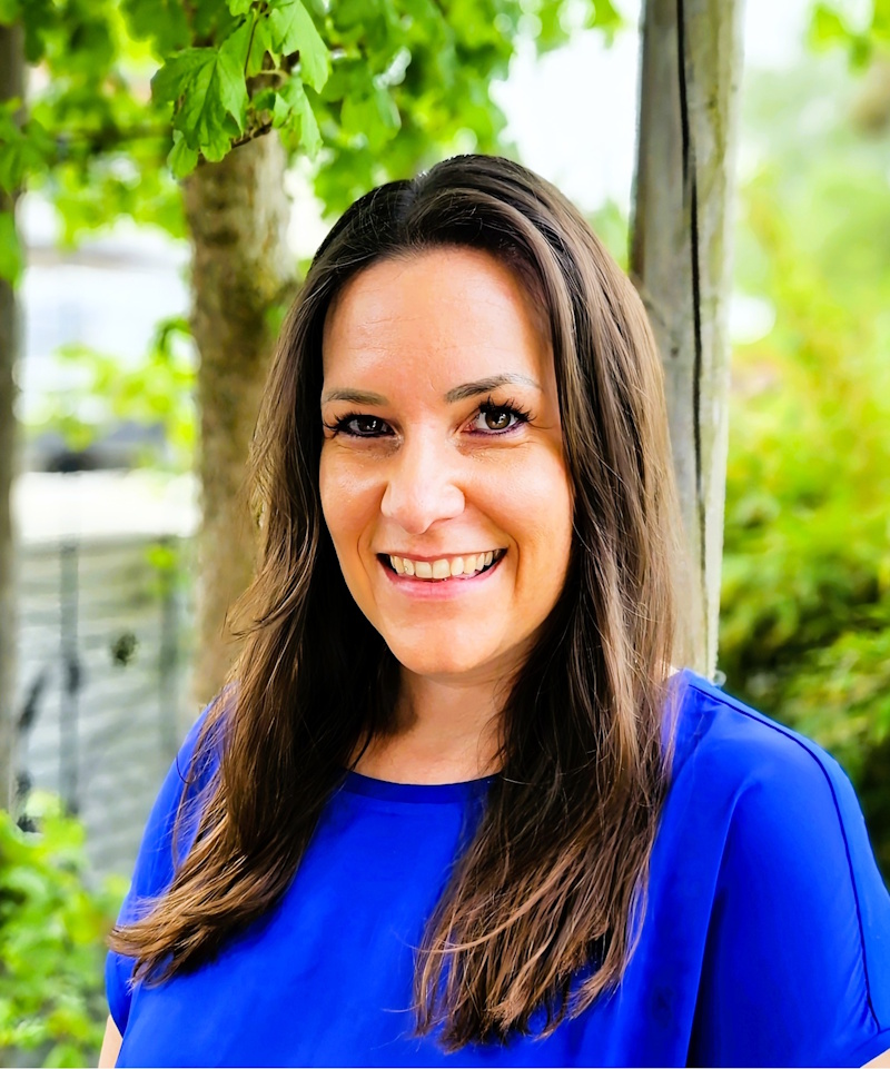 Hausfelder appears in a portrait photo. 