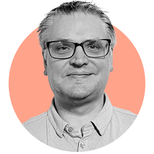 Burtness smiles in a portrait photo.