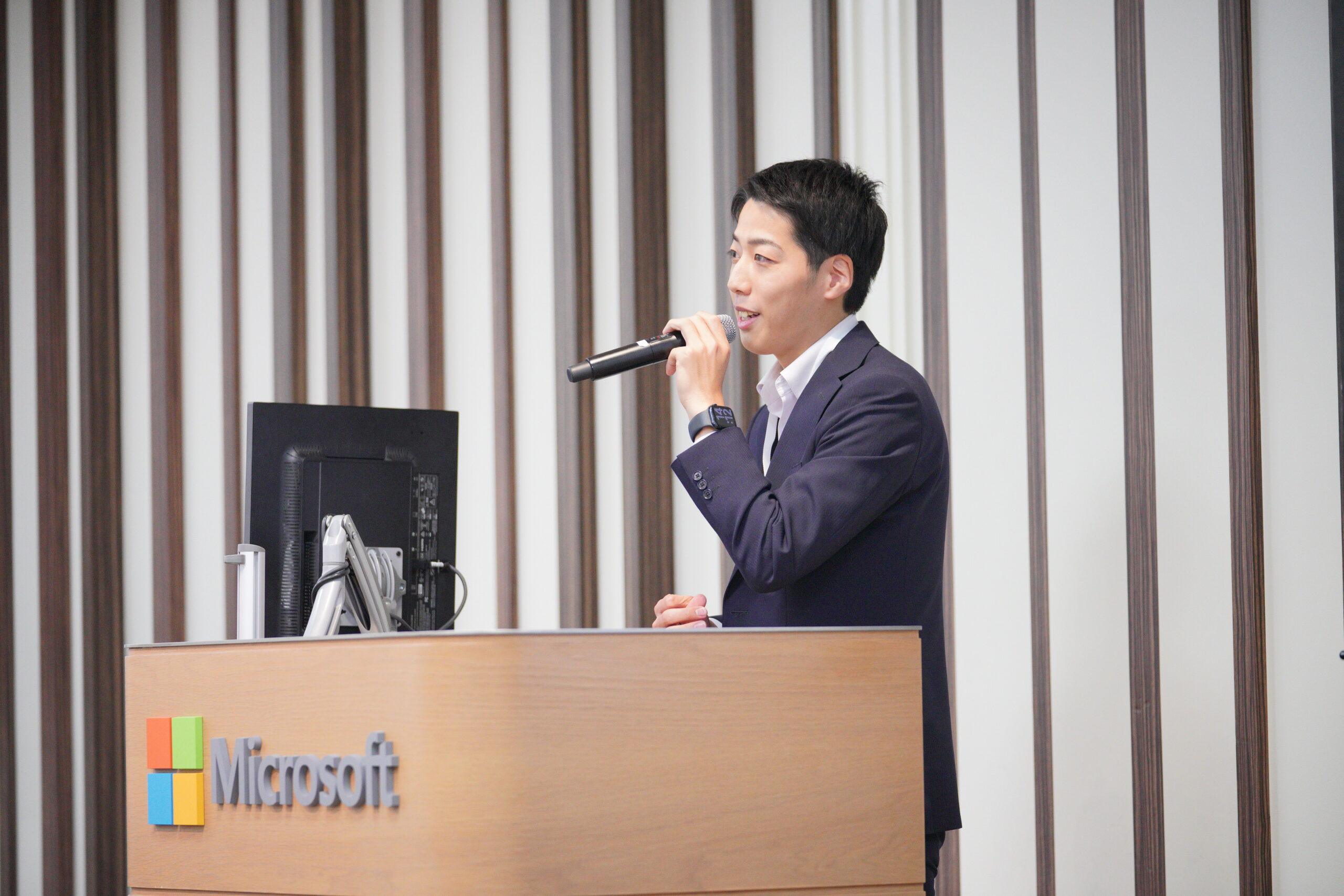 A man speaking into a microphone