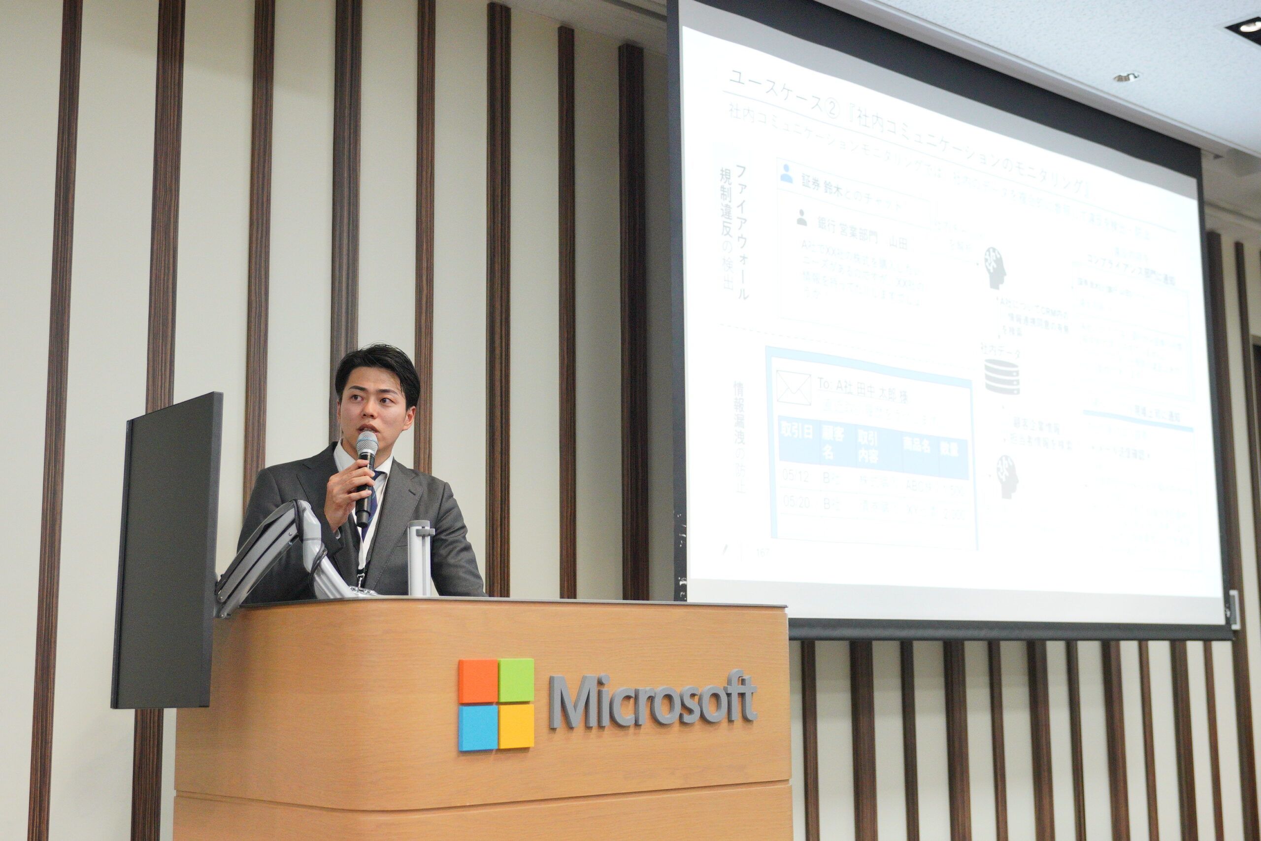 A man speaking into a microphone