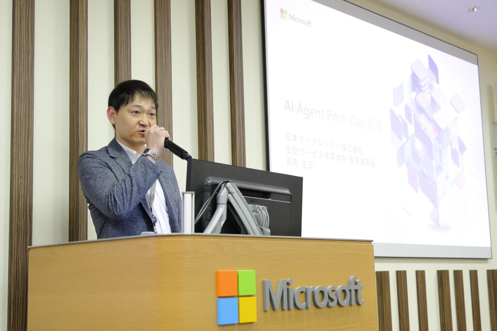 A man standing at a podium speaking into a microphone