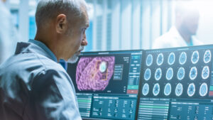 A man looking at a computer screen