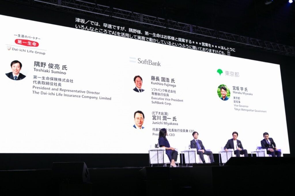 A group of people sitting on a stage