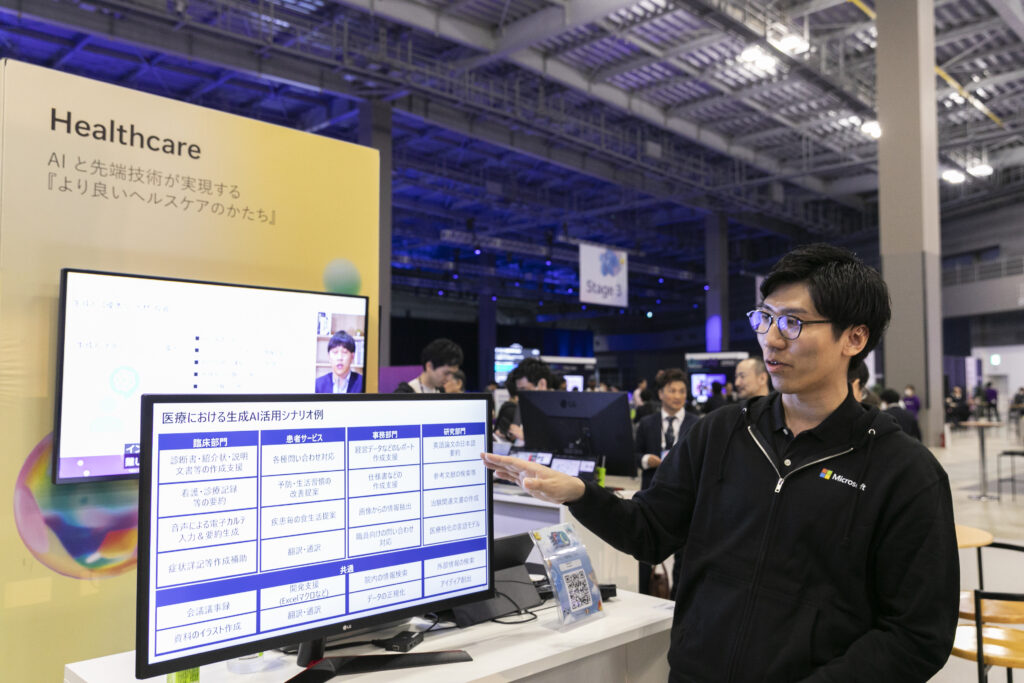 A man pointing at a computer screen