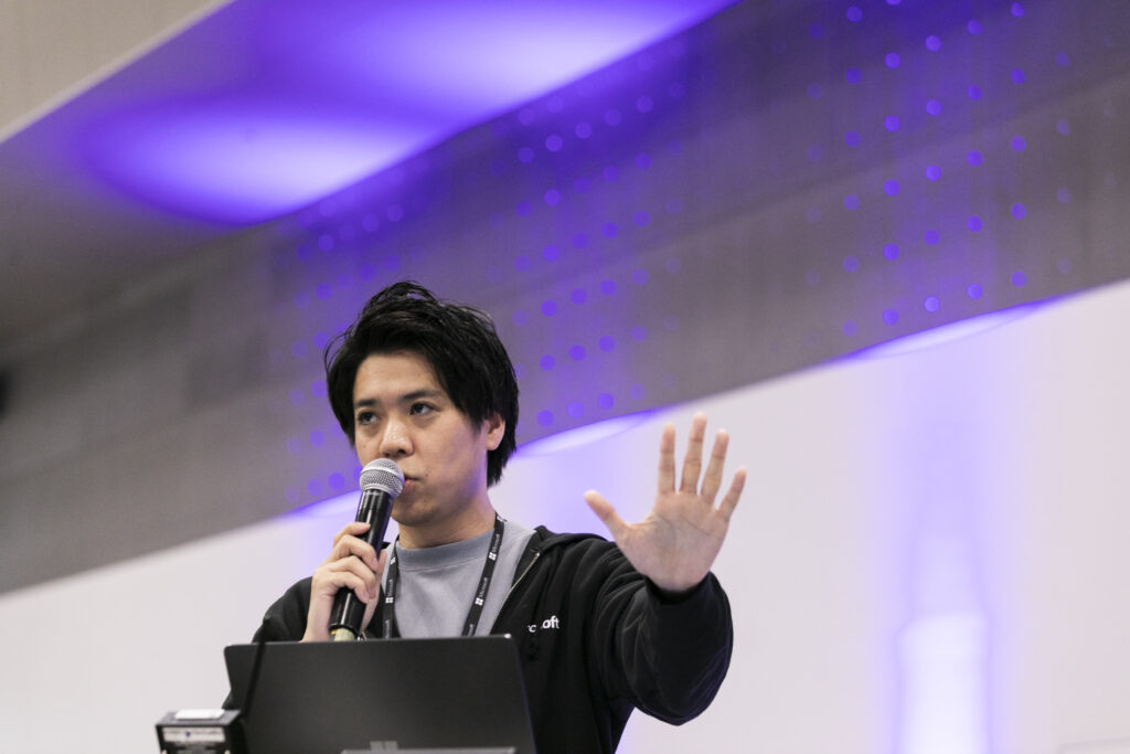 A man speaking into a microphone