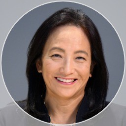 A close-up of a woman smiling