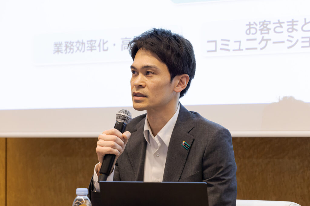 A man in a suit holding a microphone