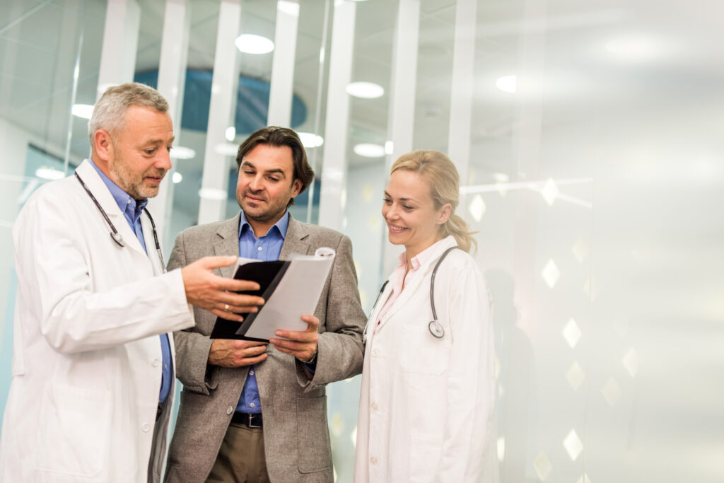 A group of doctors looking at a file