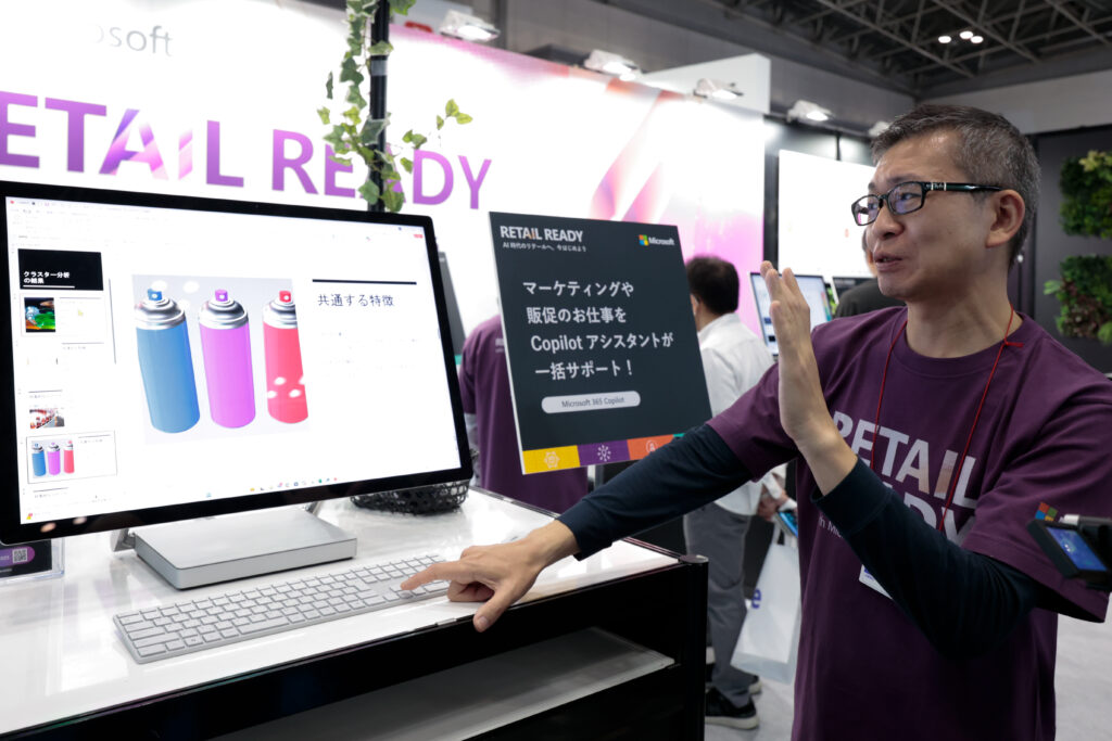 A man standing in front of a computer