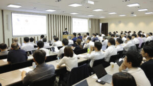 A group of people sitting in a room
