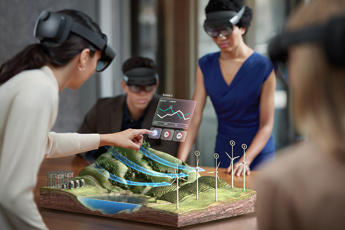 Mixed Reality で発電プラントをシミュレートする男女