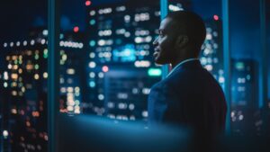 men in an office at night