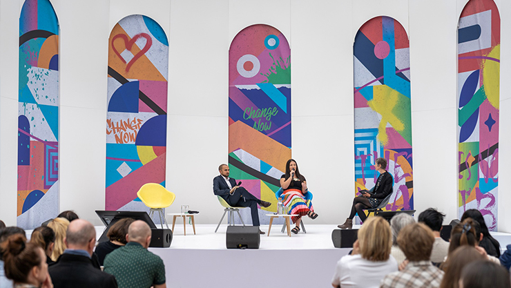 Four Entrepreneurs at work in a common area of a creative workplace